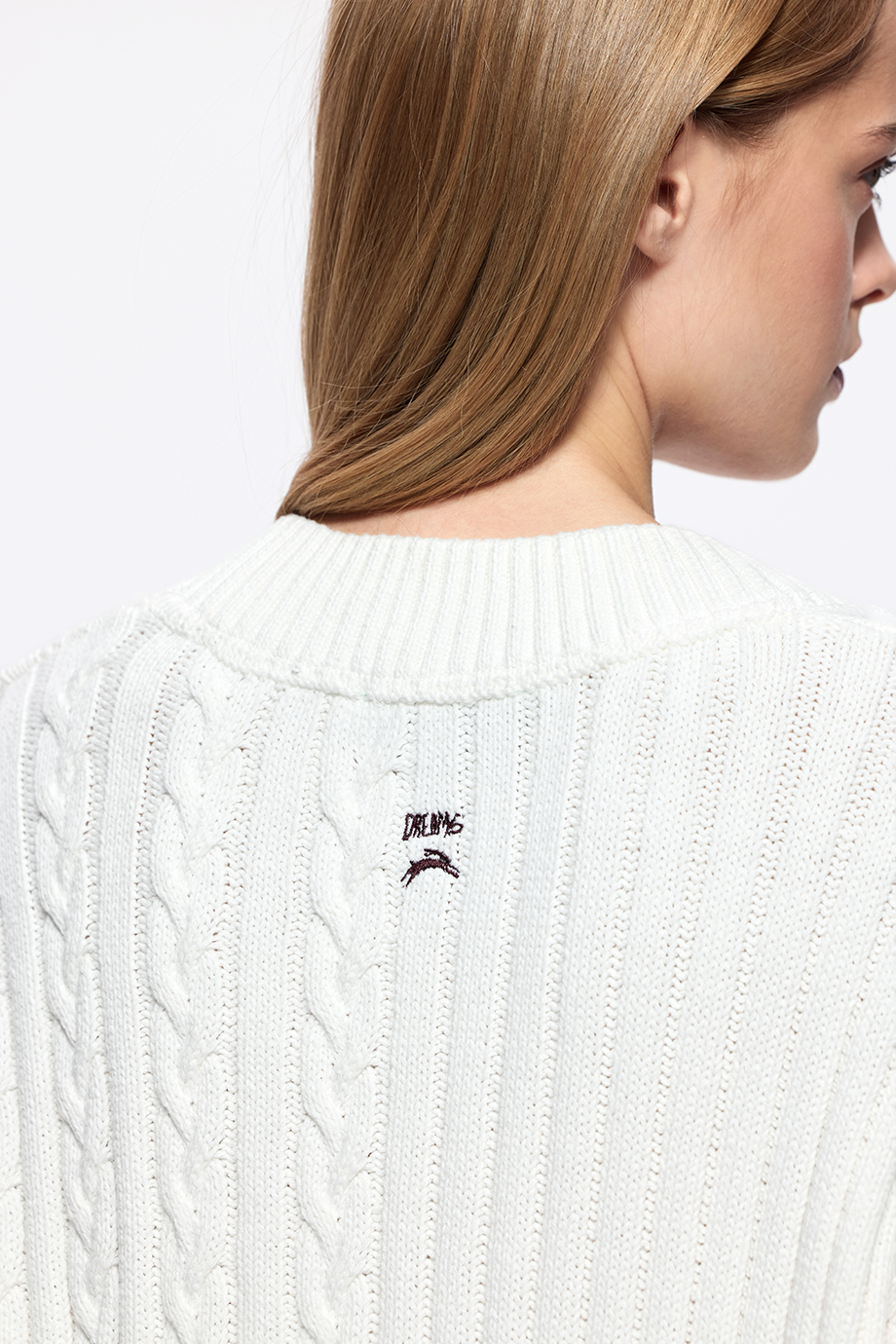 Джемпер с косами и вышивкой